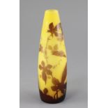 A Galle cameo glass conical vase, c.1905, decorated with a flowering climbing plant in brown, on a