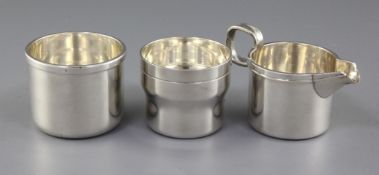 A 1970's Irish silver cream jug, sugar bowl and beaker by Rionore or Kilkenny Ltd, of plain