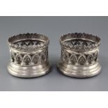 A pair of early Victorian pierced silver bottle coasters by Samuel Walker & Co, with architectural