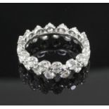 A modern white gold and claw set diamond double row full eternity ring, set with thirty two round