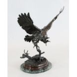 After Jules Moigniez (1835-1894), a bronze sculpture of an owl alighting on a branch, on a