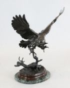 After Jules Moigniez (1835-1894), a bronze sculpture of an owl alighting on a branch, on a