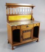 An Arts & Crafts oak washstand in the manner of Shapland & Petter, with raised tiled back, rouge