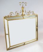 An early 20th century French gilt gesso wall mirror, of rectangular form, with marginal plates and