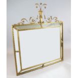 An early 20th century French gilt gesso wall mirror, of rectangular form, with marginal plates and