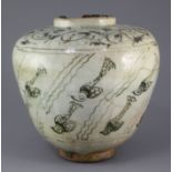 A Kashan pottery ovoid jar, 13th century, painted with stylised fish amid weed under a pale