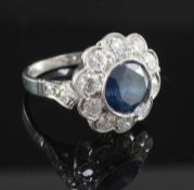 A white gold and fancy colour diamond and white diamond circular cluster ring, with accompanying HRD