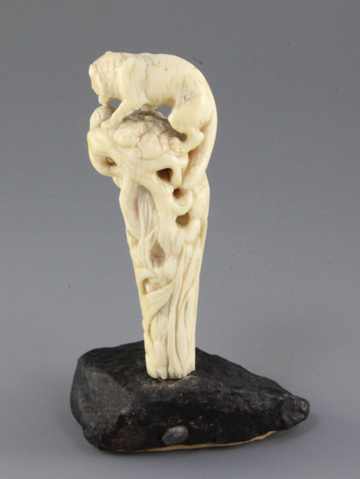 A 19th century French ivory cane handle, carved with a fox and hare, on a naturalistic stone base, - Image 2 of 2