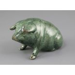 A Ewenny green glazed pottery model of a seated pig, its back inscribed 'Y.Mochyn', and incised mark