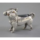 A George V novelty silver pin cushion modelled as a pug by Crisford & Morris, with tiger's eye
