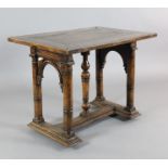 A 17th century style Spanish walnut centre table, with rectangular top on arched column