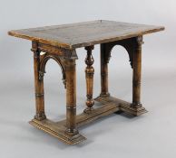 A 17th century style Spanish walnut centre table, with rectangular top on arched column