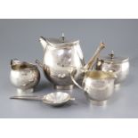 A stylish 1970's silver four piece tea set with tea strainer by Graham Watling of Lacock, of