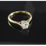 An 18ct gold and platinum, solitaire diamond ring, the round brilliant cut stone weighing