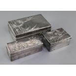 Three early 20th century Japanese textured silver toilet boxes, two signed Miyamoto Shoko, with
