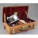 A Leica camera no.323631, in leather case, with Elmar F9 and Summaron F2.8 lenses and other