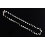 A Victorian style gold, diamond and cultured pearl set necklace, the S-scroll links set with old and