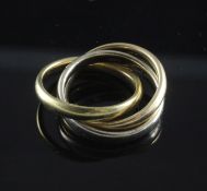 A 1990's three colour 18ct gold triple band "Russian Wedding" ring, 10.2 grams, size F.