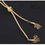 A 20th century Israeli 18ct gold double drop tassel necklace, with reeded knot slide, overall 30in.