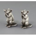 A pair of late Victorian novelty silver pepperettes by Saunders & Shepherd, each modelled as a