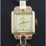 A lady's 1950's 9ct gold Rolex Precision manual wind wrist watch, with Arabic and baton numerals, on