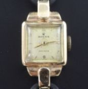 A lady's 1950's 9ct gold Rolex Precision manual wind wrist watch, with Arabic and baton numerals, on