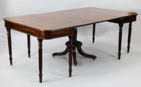 A Regency Irish mahogany extending dining table, with two D ends and central drop leaf section, W.