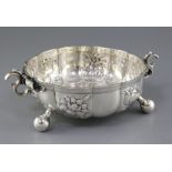 An Edwardian Carolean style textured silver circular fruit bowl, with scroll handles and embossed