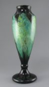 A Daum Nancy green mottled and foil decorated vase, c.1925, of slender baluster form, on a spreading