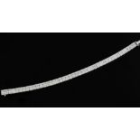 An attractive 18ct white gold and diamond line bracelet, set with baguette and round cut diamonds