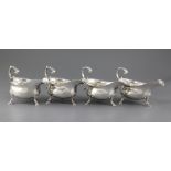 A set of four George III silver sauceboats by Thomas Shepherd, with cut cusped borders, engraved