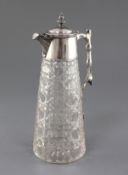 A late Victorian silver mounted cut glass claret jug by Goldsmiths & Silversmiths Co. Ltd, or