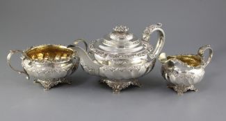 A George IV silver three piece tea set by Richard Pearce & George Burrows, of circular form, with