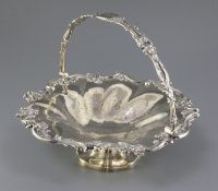An early Victorian silver fruit basket, with foliate scroll border and similar engraved