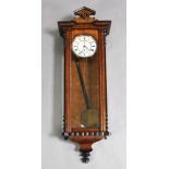 A 19th century walnut and ebonised Vienna wall timepiece, in architectural case, H.44in.