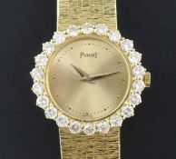 A lady's 1980's 18ct gold and diamond Piaget manual wind wrist watch, the dial with dot markers