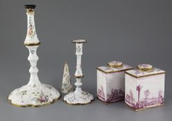 A pair of South Staffordshire enamel tea caddies and covers, and two similar candlesticks, late 18th