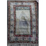 A Panderma part silk pale green/grey ground prayer rug, with central mihrab and three row foliate