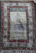 A Panderma part silk pale green/grey ground prayer rug, with central mihrab and three row foliate