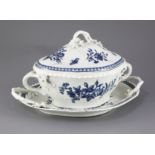 A Worcester lozenge shaped tureen cover and stand, c.1775, blue printed in the three flowers