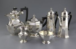 A George V matched four piece octagonal silver tea set and a cafe au lait pair, Thomas Bradbury &