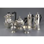 A George V matched four piece octagonal silver tea set and a cafe au lait pair, Thomas Bradbury &