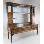 A mid 18th century mahogany banded oak dresser, with three shelf rack and three long drawers, on
