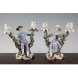 A pair of Meissen figural candelabra, late 19th century, modelled as a lady and a gentleman in