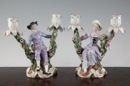 A pair of Meissen figural candelabra, late 19th century, modelled as a lady and a gentleman in