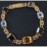 A Brazilian gold and gem set bracelet, mounted with seven stones including aquamarine and citrine,