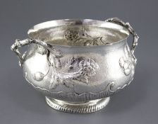 A late Victorian textured silver two handled fruit bowl by Carrington & Co, with rustic handles