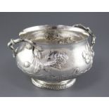 A late Victorian textured silver two handled fruit bowl by Carrington & Co, with rustic handles