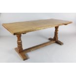 A Robert 'Mouseman' Thompson oak refectory table, with rounded rectangular top on octagonal end