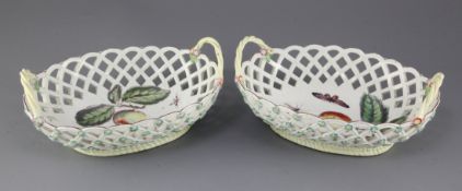 A pair of Derby polychrome pierced oval baskets, c.1760, each painted with fruit and insects to